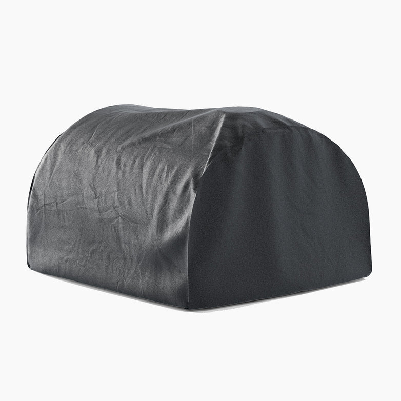 A dark green, rectangular cover draped over a large object with a rounded, dome-like top; the Build in Oven Cover for Merinara & Bellagio is crafted from heavy-duty PVC-lined material for maximum durability.