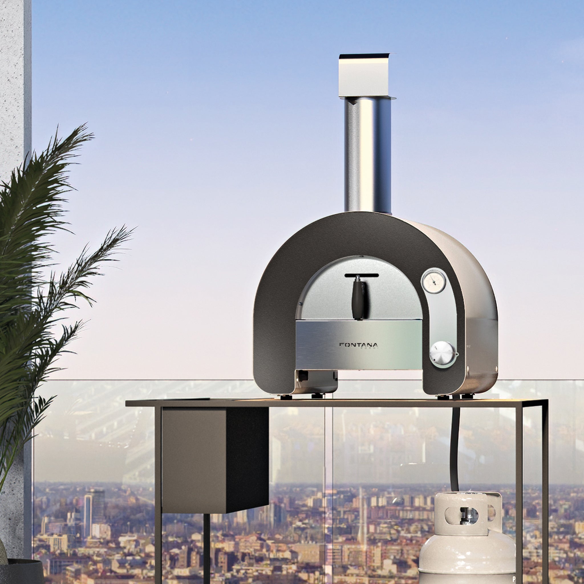 The Fontana Maestro 40 Gas Pizza Oven offers efficient air circulation, perfect for your balcony with a stunning cityscape backdrop and a nearby potted plant. Ideal for Italian cooking enthusiasts.