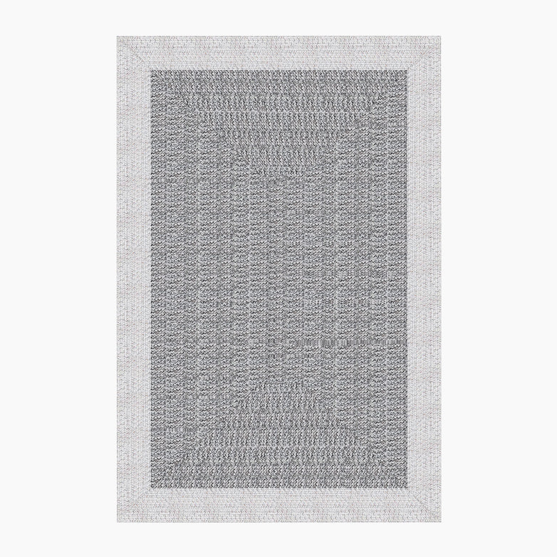 The Hades 220cm x 160cm Weatherproof Indoor and Outdoor Rug in Cobble Grey features a rectangular grey and white design with a herringbone pattern and a thick, light grey border. Made from 100% polypropylene, this UV resistant rug is both stylish and durable.