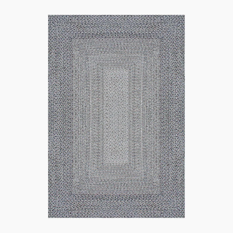 The Hestia 220cm x 160cm Weatherproof Indoor and Outdoor Rug in Walnut Grey features a rectangular braided design with a pattern of concentric rectangles in grey, blue, and white, and is UV-resistant.