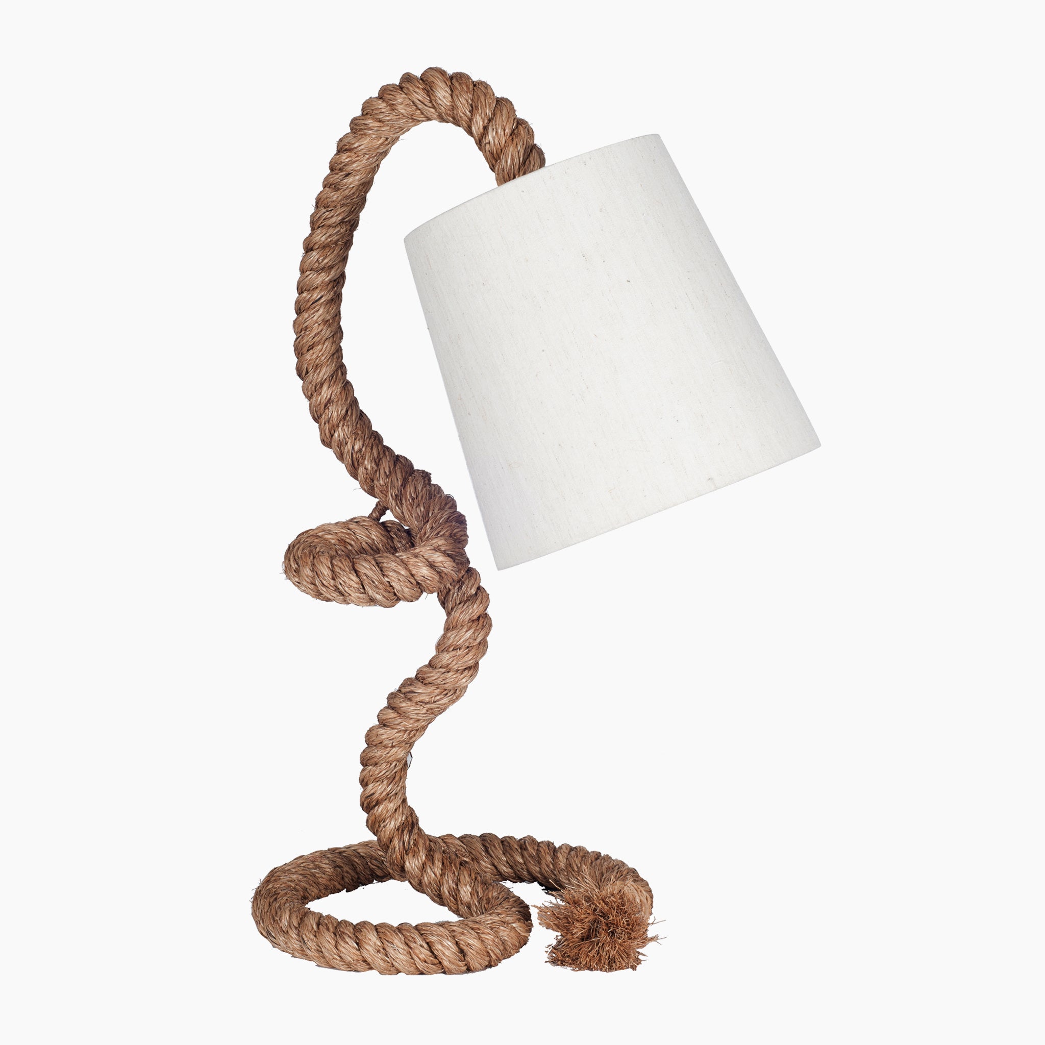 The Pacific Lifestyle Martindale Task Table Lamp embodies coastal charm, showcasing a twisted rope stand complemented by a natural cotton shade against a white backdrop.